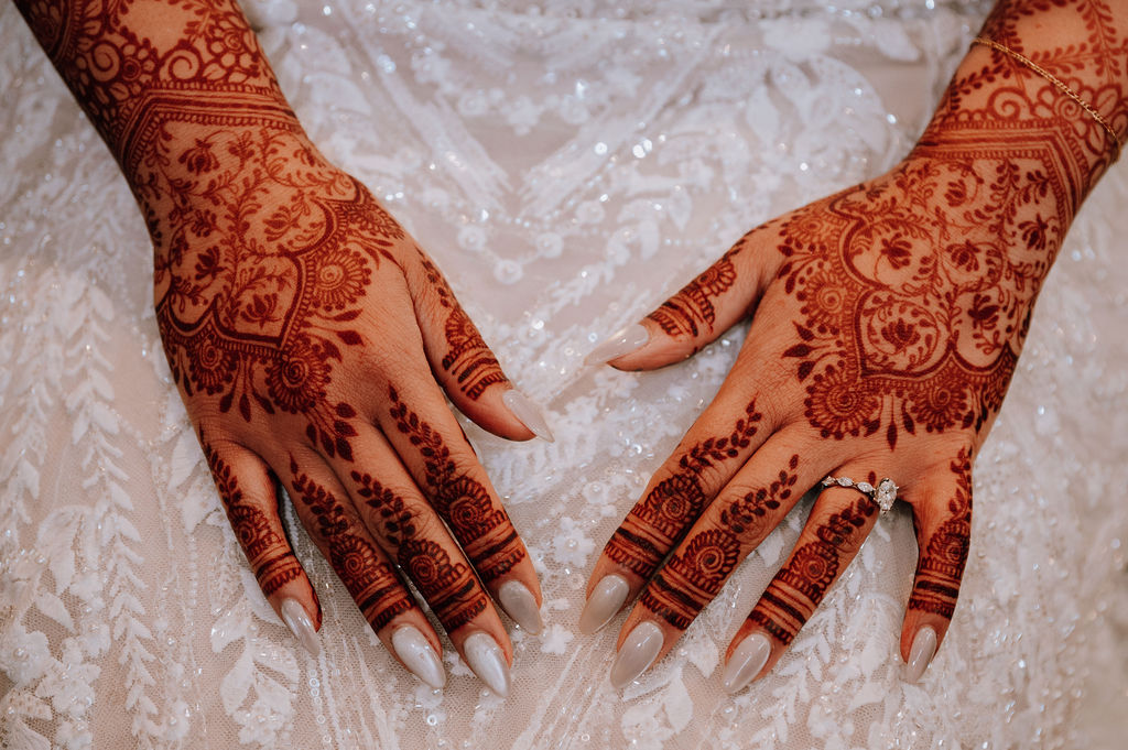 Joyful Nigerian wedding celebration with bride in vibrant aso-ebi and gele